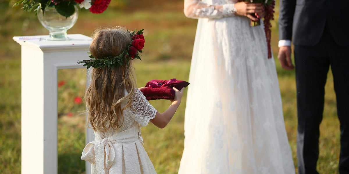 girl carrying wedding ring